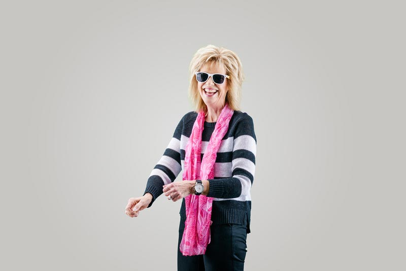 laughing middle aged woman with sunglasses
