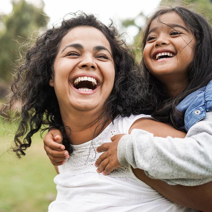 laughing mother and daughter